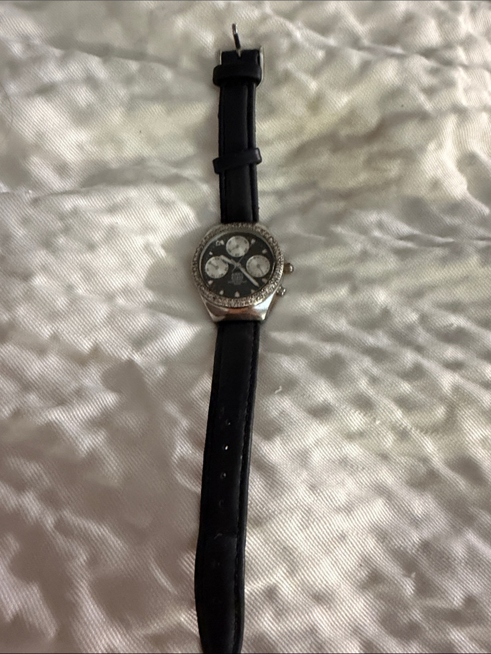 Anne Klein Black Leather Strap Silver-Tone Crystal Accent Watch needs battery